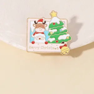 Detail of enameled Christmas brooch with reindeer, Santa Claus, and tree inside a frame