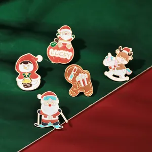 Detailed view of Christmas enamel lapel pins set including Santa and gingerbread man