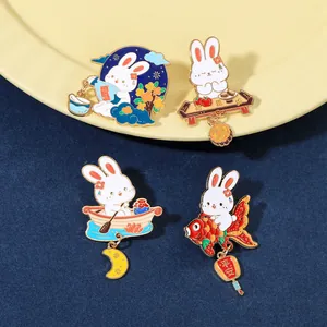 Detailed macro view of four cute rabbit enamel pins with traditional festive pendants