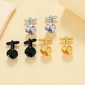 Detailed set of twisted knot cufflinks in silver, black, and gold metal finishes
