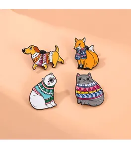 Detailed close-up of winter animal enamel pins featuring cat fox dog and polar bear