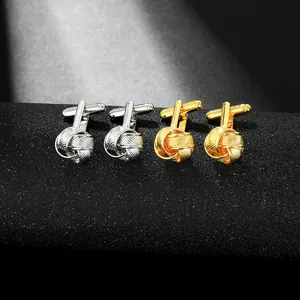 Detail of twisted metal knot cufflinks in silver and gold with T-bar closure for men