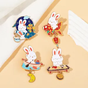 Detail of cute rabbit enamel pins with traditional mooncake and lantern motifs