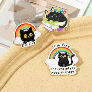 Detailed close-up of colorful black cat enamel pins with rainbow and therapy quotes