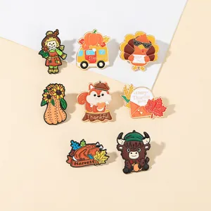 Detailed close-up of colorful Thanksgiving enamel pins set with turkey and pumpkin designs
