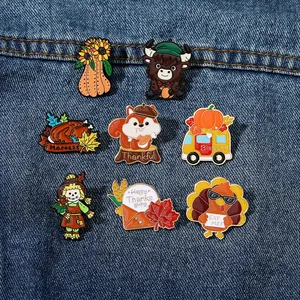 Detailed set of 8 autumn enamel pins with turkey and pumpkin on blue denim fabric