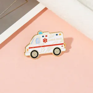 Detailed macro of a gold-trimmed ambulance enamel brooch for medical professionals