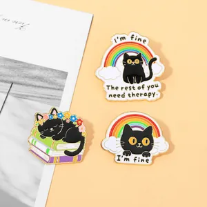 Detailed view of three enamel cat pins featuring humorous quotes and colorful rainbow designs