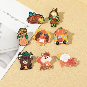 Macro detail of eight Thanksgiving enamel pins featuring turkeys and autumn motifs