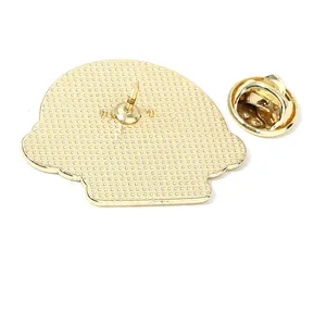 Golden enamel cat pin back with anti-slip texture and butterfly clasp on white background