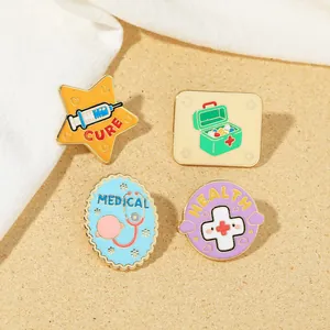 Detail of four creative medical enamel pins with stethoscope and medical bag designs