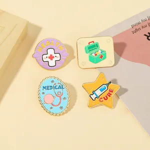 Detail of medical enamel pins showing stethoscope, first aid kit and syringe icons