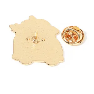 Back view of golden metal cartoon badge with butterfly clutch and textured finish