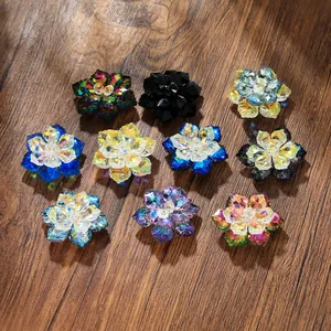 Macro shot of colorful crystal flower cufflinks with faceted glass on a dark wood background