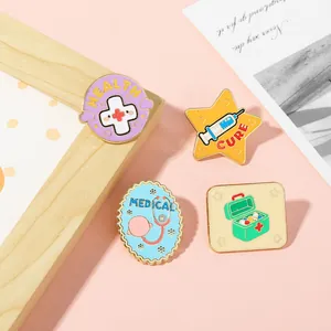 Close-up of colorful medical enamel pins including a stethoscope, syringe, and medicine box