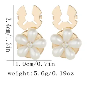 Elegant gold flower cufflinks with white pearl petals and sparkling crystal rhinestones
