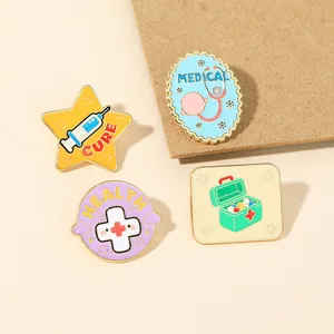 Set of four colorful medical enamel pins including stethoscope and health symbols