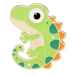 Cute green cartoon dinosaur enamel brooch with orange fins and gold plating finish