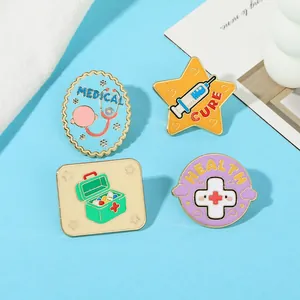 Detailed view of four colorful enamel medical brooches with stethoscope and pill symbols