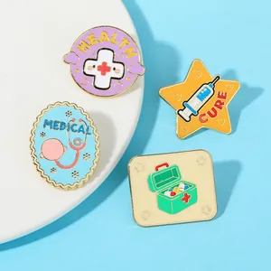 Close-up of four colorful medical enamel pins with Health Cure and Medical text