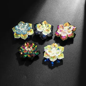 Detailed macro shot of crystal flower cufflinks in multiple vibrant iridescent colors