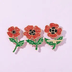 Detailed set of red poppy crystal brooches with Veterans Day and 11.11 text engravings