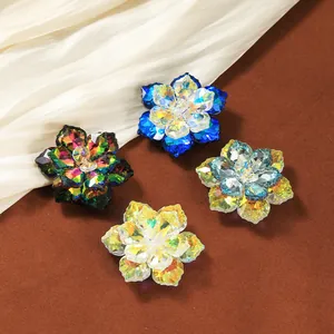 Macro detail of assorted crystal flower accessories with multi-faceted petals and vibrant colors