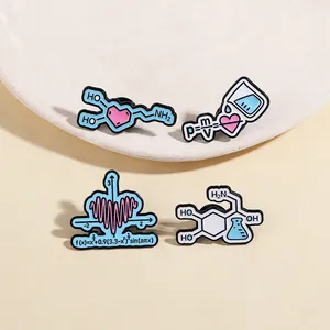 Set of four creative science enamel pins with heart-shaped math and physics formulas
