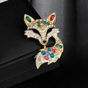 Detailed view of fox brooch featuring multicolored rhinestones on a gold-plated base