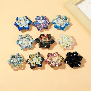 Macro detail of assorted crystal flower cufflinks showing multifaceted glass cutting and sparkle