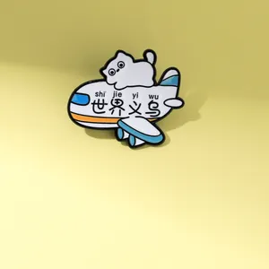 Detailed view of enamel cat airplane brooch with colorful metal finish and cute design