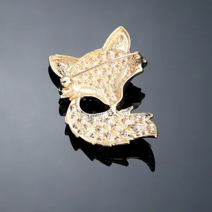 Back view of gold fox brooch featuring intricate honeycomb texture and secure pin clasp