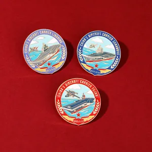 Three Chinese aircraft carrier enamel pins on red velvet featuring Liaoning, Shandong, and Fujian