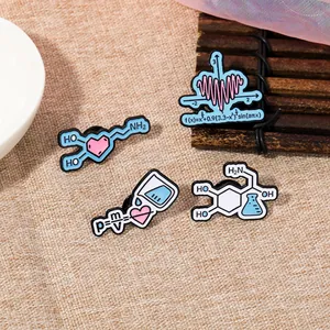 Detailed macro view of enamel pins featuring scientific formulas and chemistry symbols