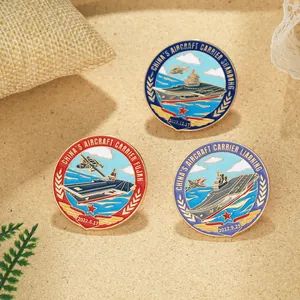 Detailed view of three metal enamel military badges featuring Chinese aircraft carriers