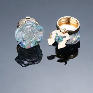 Close-up of translucent iridescent rose petal clips with polished gold metal base