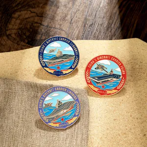 Detailed set of three aircraft carrier enamel pins on a textured beige and rustic background