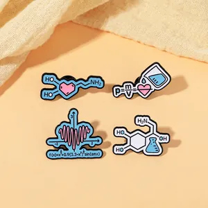 Detail shot of science enamel pins showing math heart function and physics density formulas