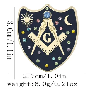 Detail of Masonic shield brooch showing dimensions 3.0cm by 2.7cm and blue enamel work