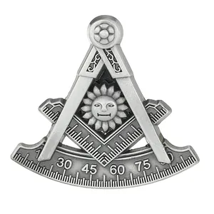 Detailed macro view of vintage silver Freemasonry compass and sun emblem brooch