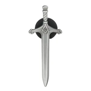 Macro detail of silver long sword pin featuring Masonic logo with a rubber clutch back