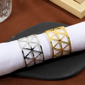 Modern hollow geometric metal napkin ring in gold and silver finish with triangle pattern