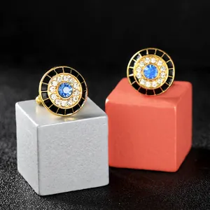 Golden Evil Eye cufflinks with blue crystal and white rhinestones on geometric stands