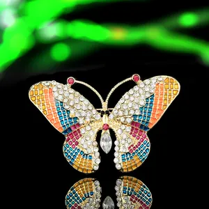 Close-up of a luxury alloy butterfly brooch with colorful enamel and sparkling rhinestones