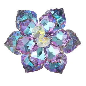 Macro detail of a crystal flower button with purple and blue gradient faceted petals