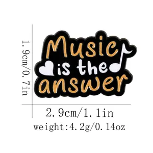 Detail view of cartoon enamel music brooch with dimensions and weight specifications