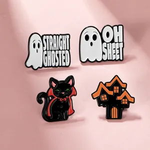 Macro detail of Halloween enamel pins featuring ghost, black cat, and haunted castle designs