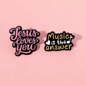 Enamel pins set with Jesus loves you and Music is the answer quotes on pink background