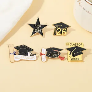 Detailed set of 2026 graduation enamel pins with gold tassels and black mortarboard motifs