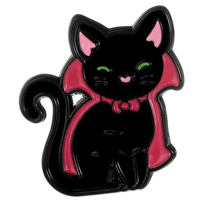 Halloween enamel pin featuring a black cartoon vampire cat with a red cloak and green eyes